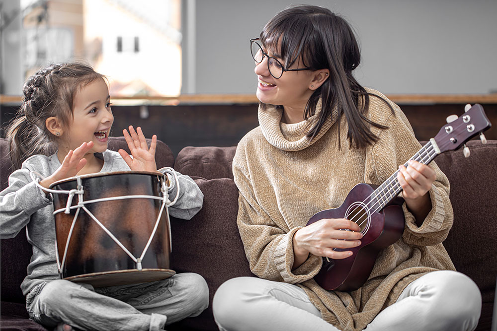 Mother & Daughter Playing Instruments